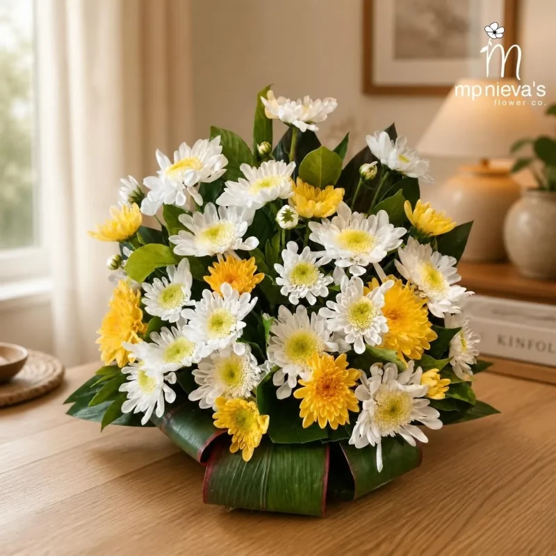 Amber low arrangement of white and yellow chrysanthemums by MP Nieva's Flower Shop