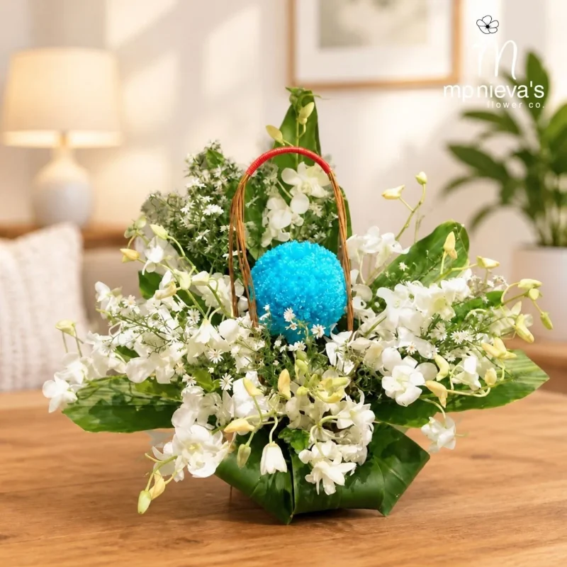 Azure memorial basket with white dendrobium orchids by MP Nieva's Flower Shop