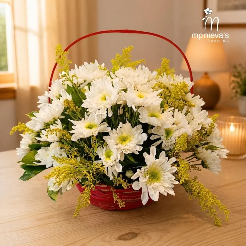 Ivory basket of white chrysanthemums in a red basket by MP Nieva's Flower Shop