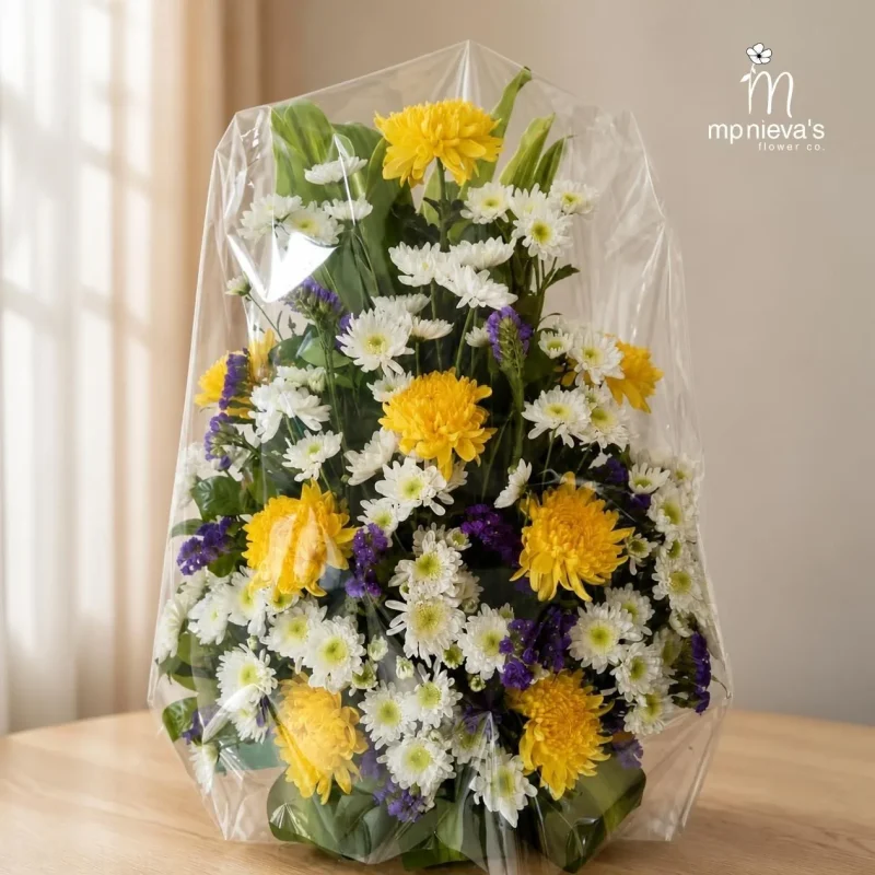 Sunrise with yellow chrysanthemums, white daisies and purple statice by MP Nieva's Flower Shop