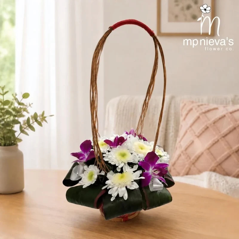 Violet Mist memorial basket with white chrysanthemums and purple orchids by MP Nieva's Flower Shop